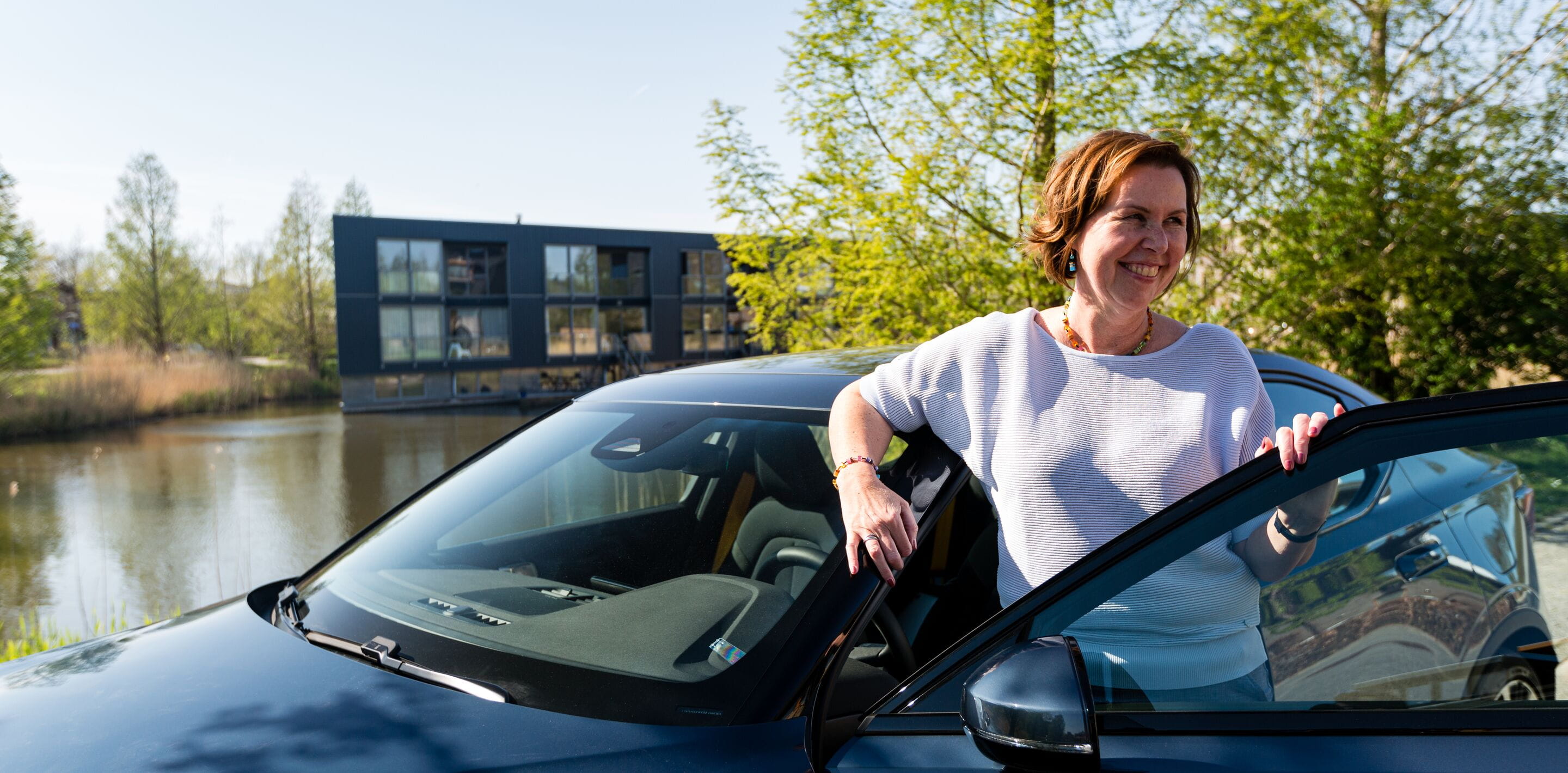 Woman opening car door