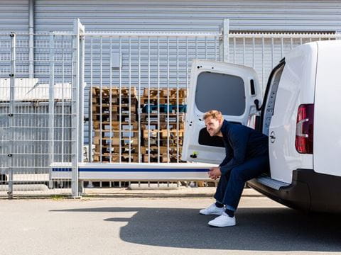 Man sitting on white van