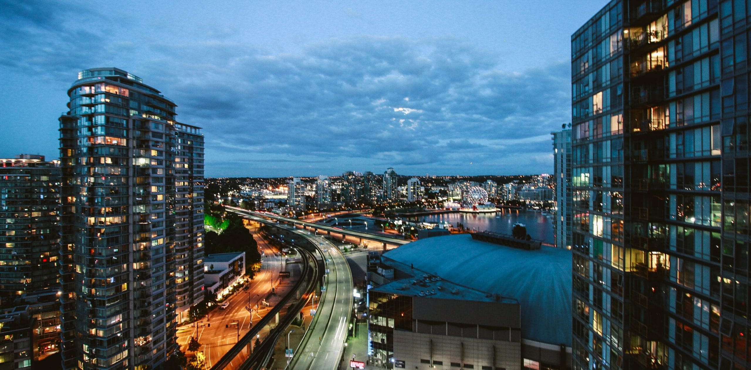 Aerial-shot-city-at-night-scaled