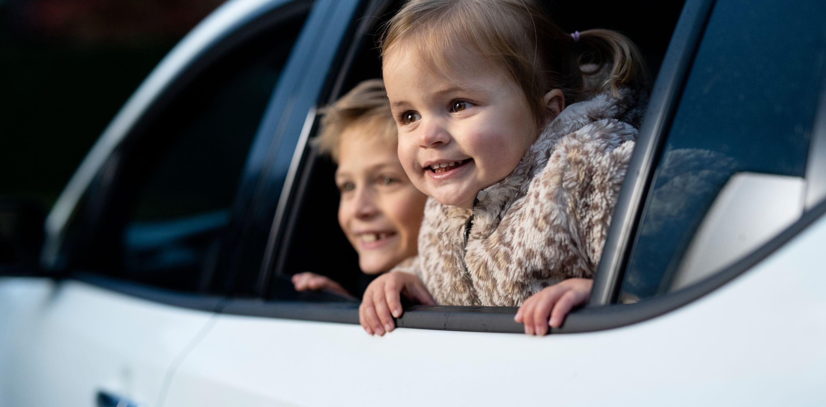 Children on the back seats of a car