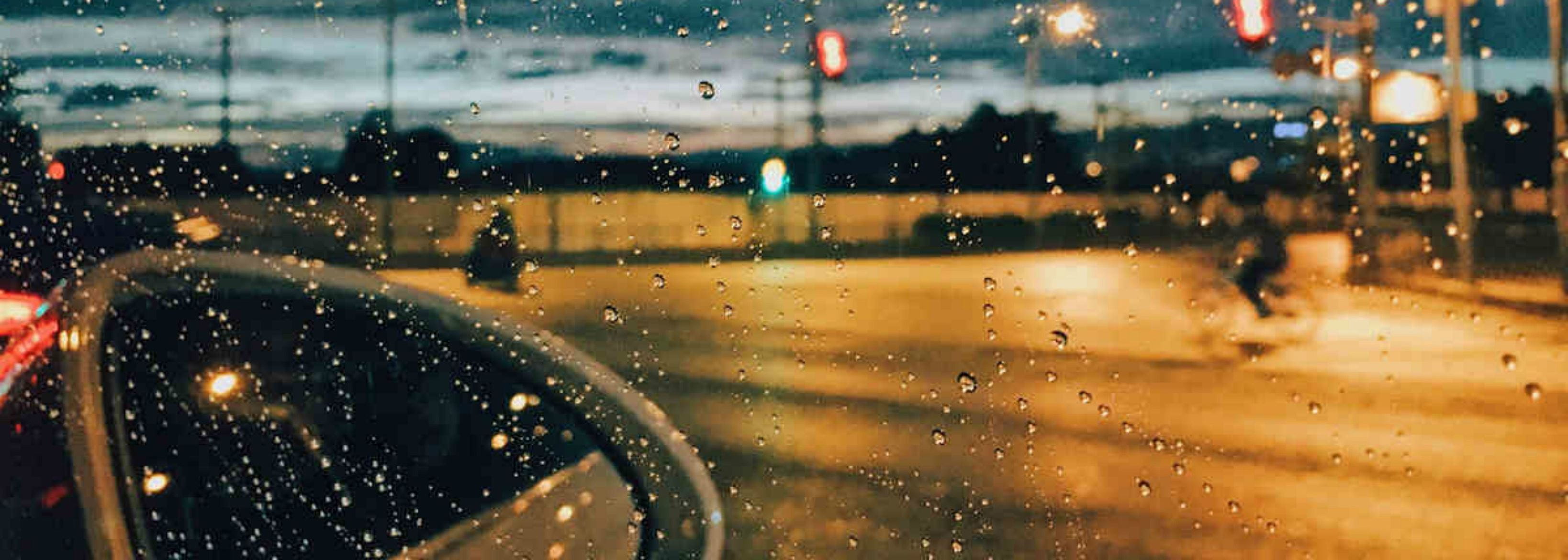 Car's mirror - rainy street