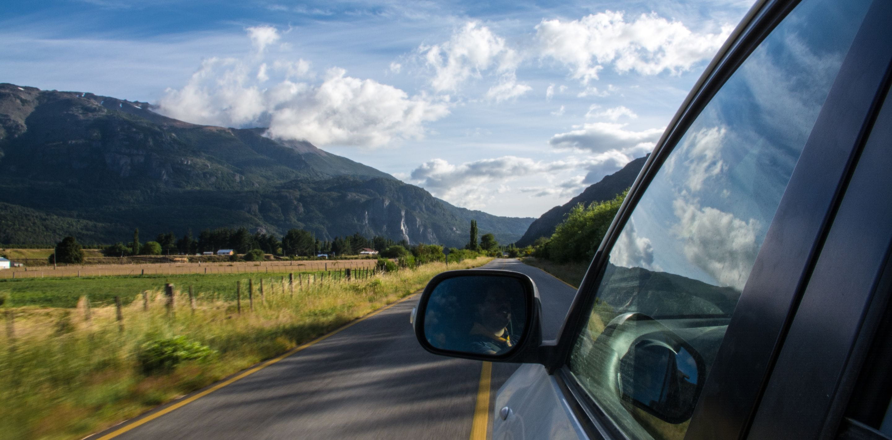 Mirror of a car driving on the countryside