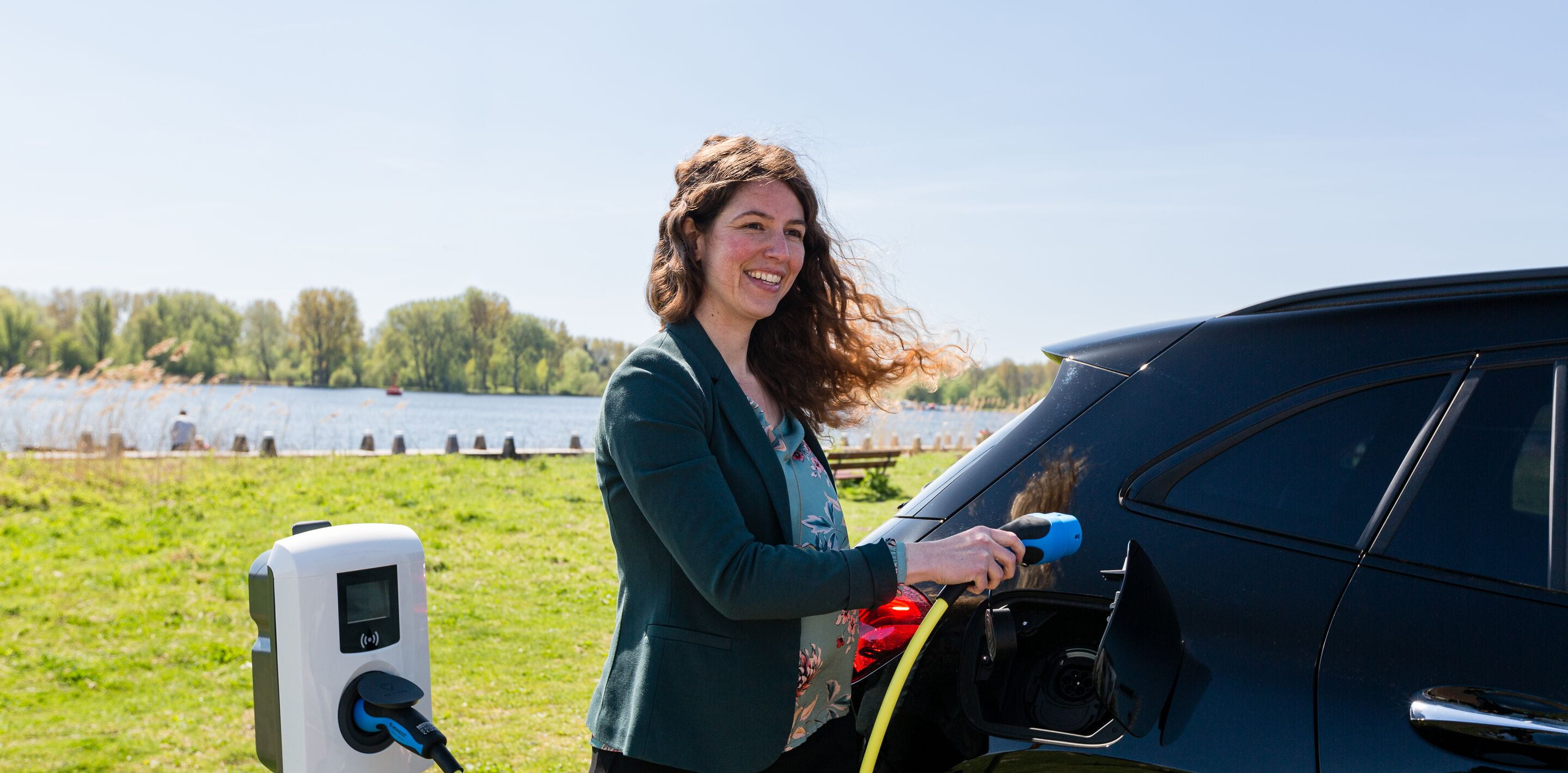 Woman and plug in vehicle