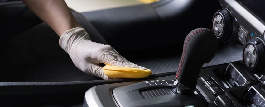 Cleaning car interior with sponge