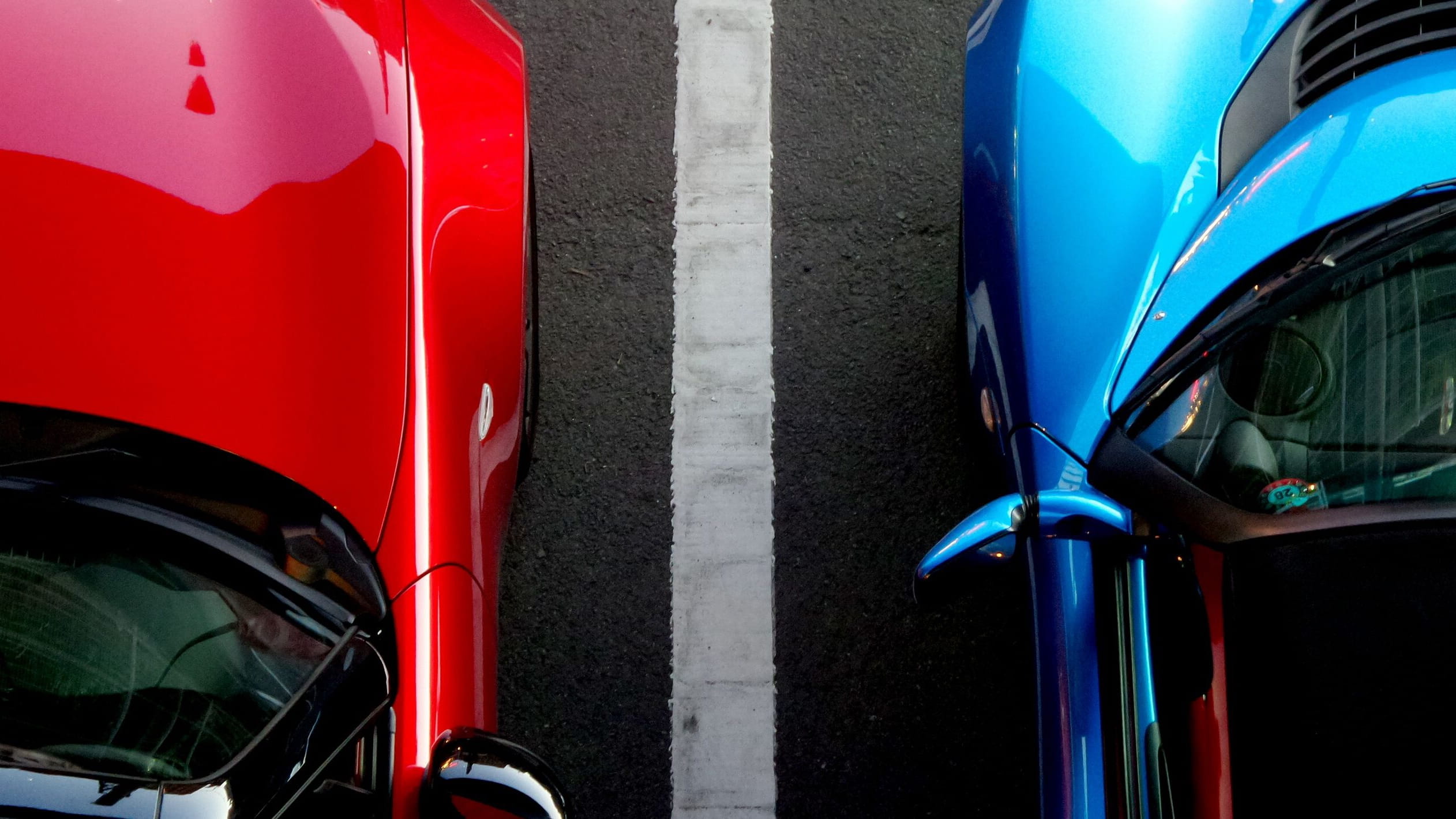 Blue and red car parked