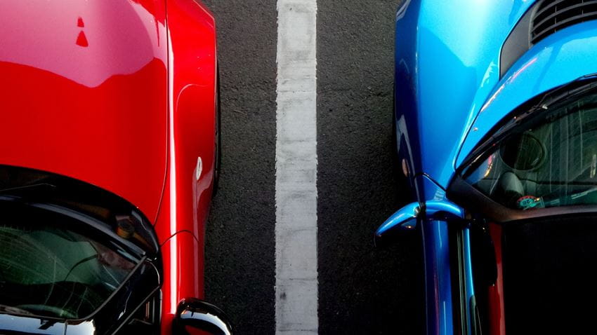 Blue and red car parked