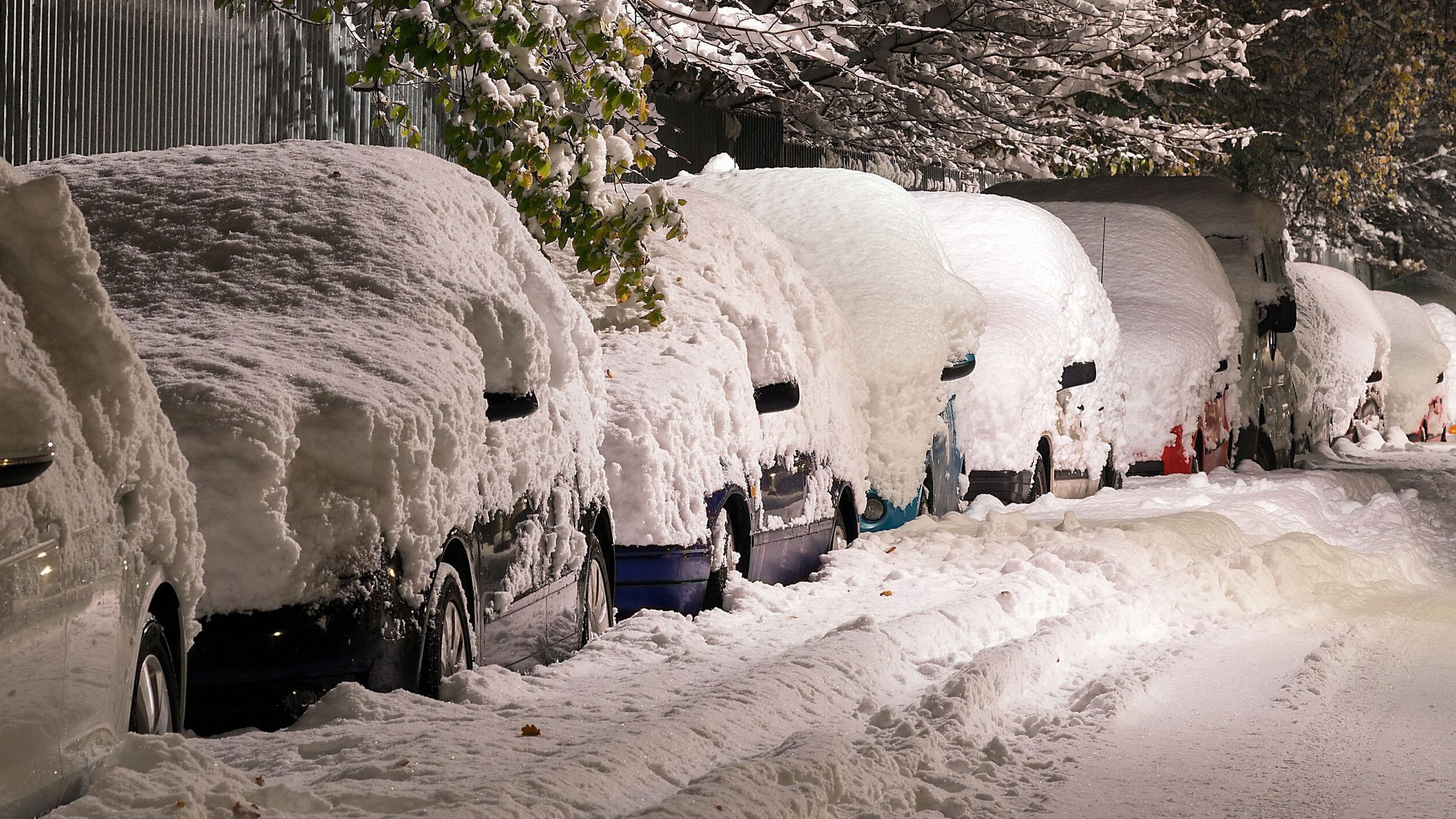 Cars parked in heavy snow