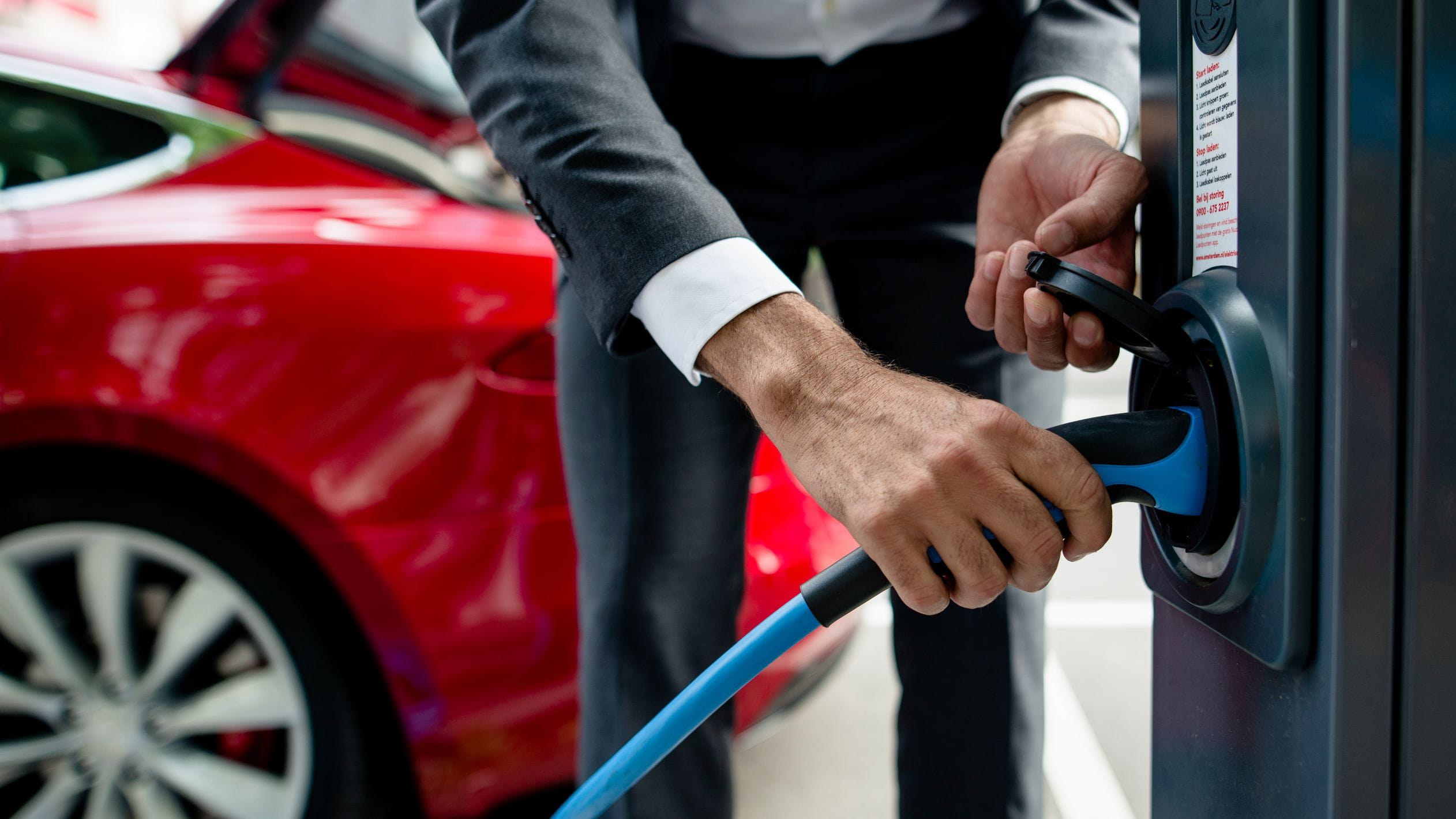 Man charging EV car