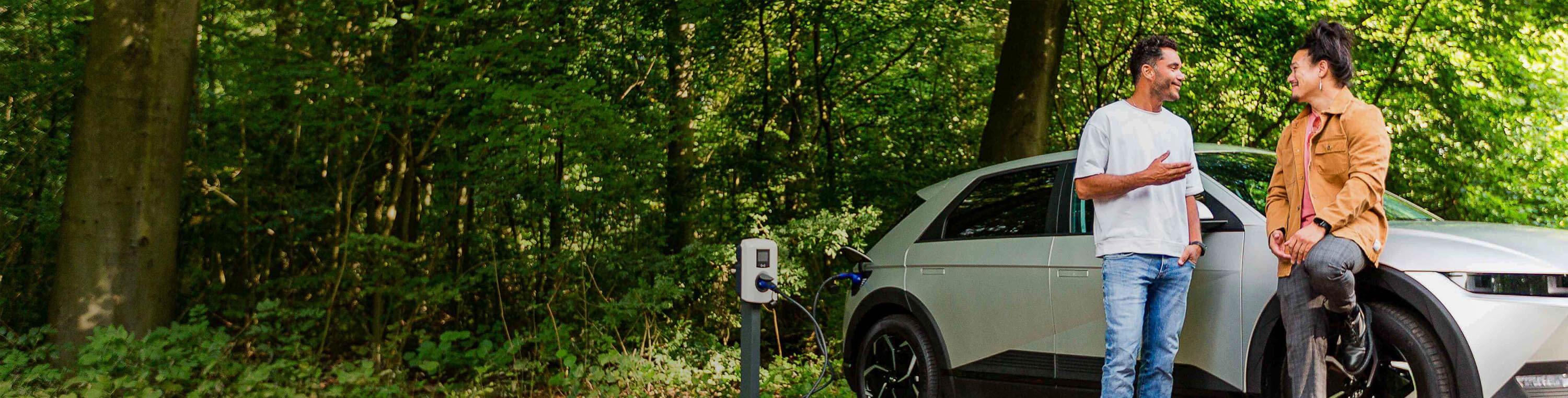 EV in forest charging - two people - hyundai ioniq (1)