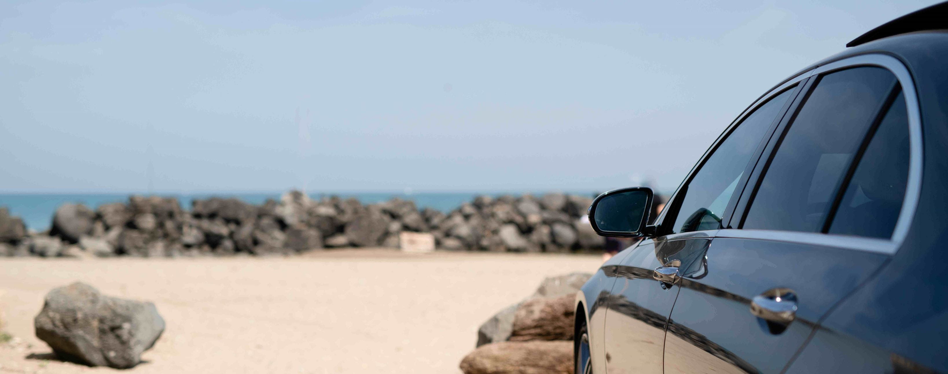 Car parked for summer holiday on Italian beach