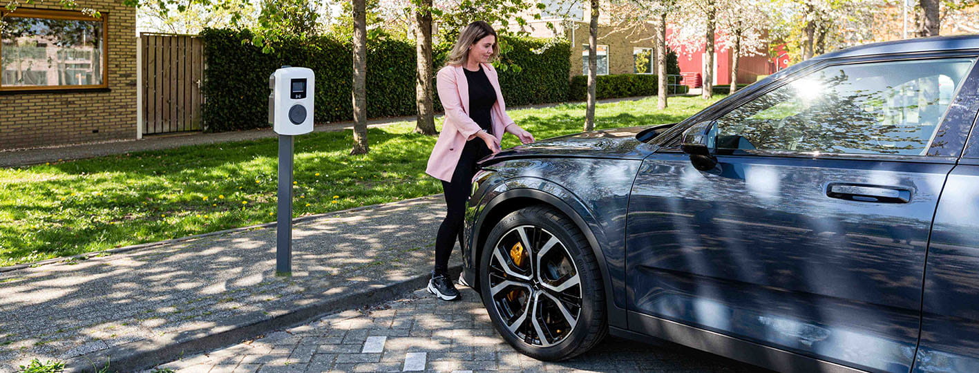 Opening Polestar bonnet with charger in frame