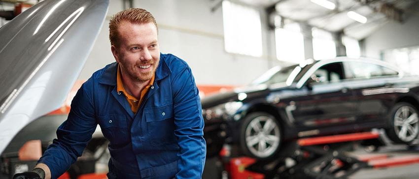 Man working on car - space on right side