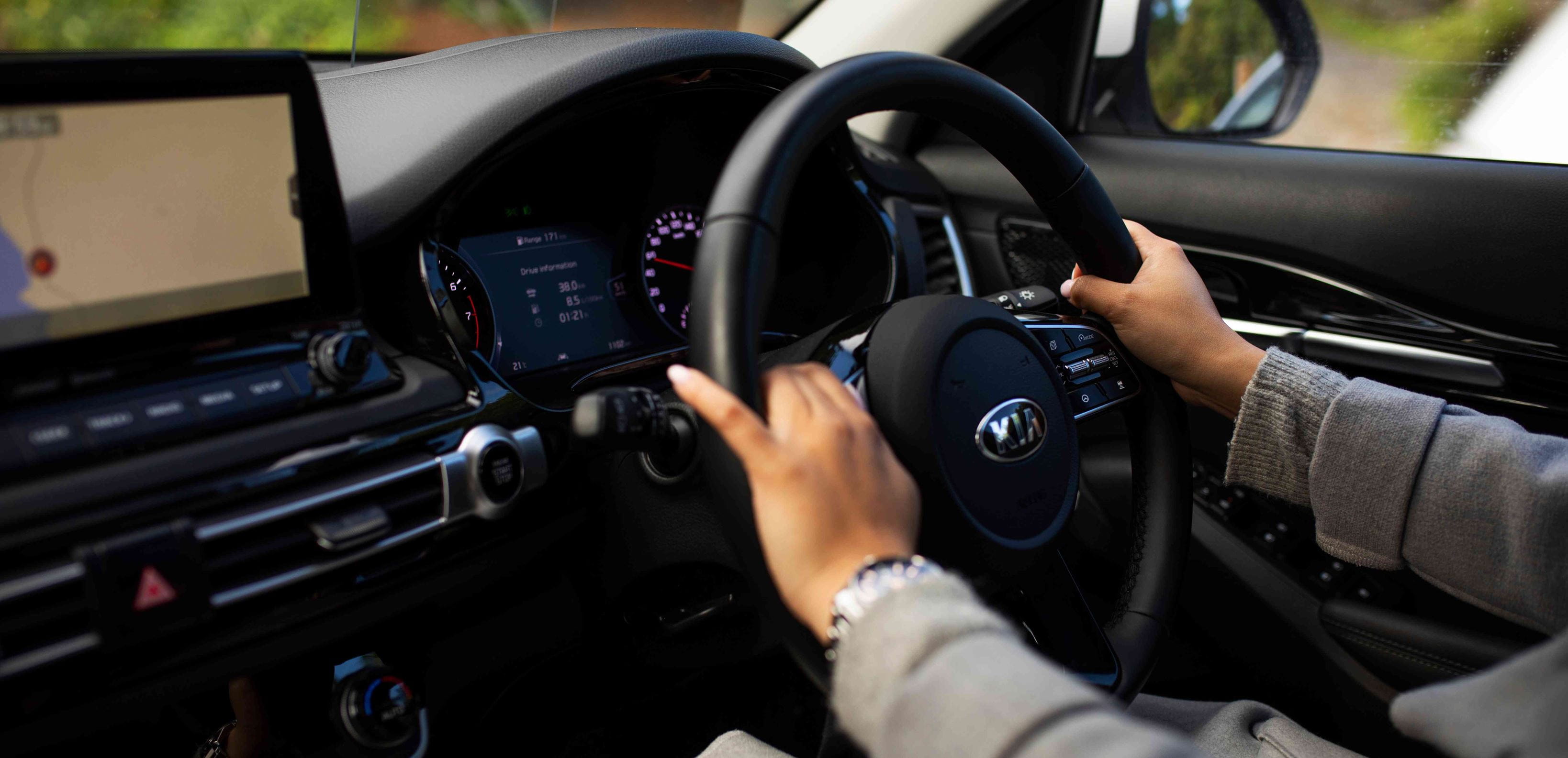 Close up - male hands on the steering wheel