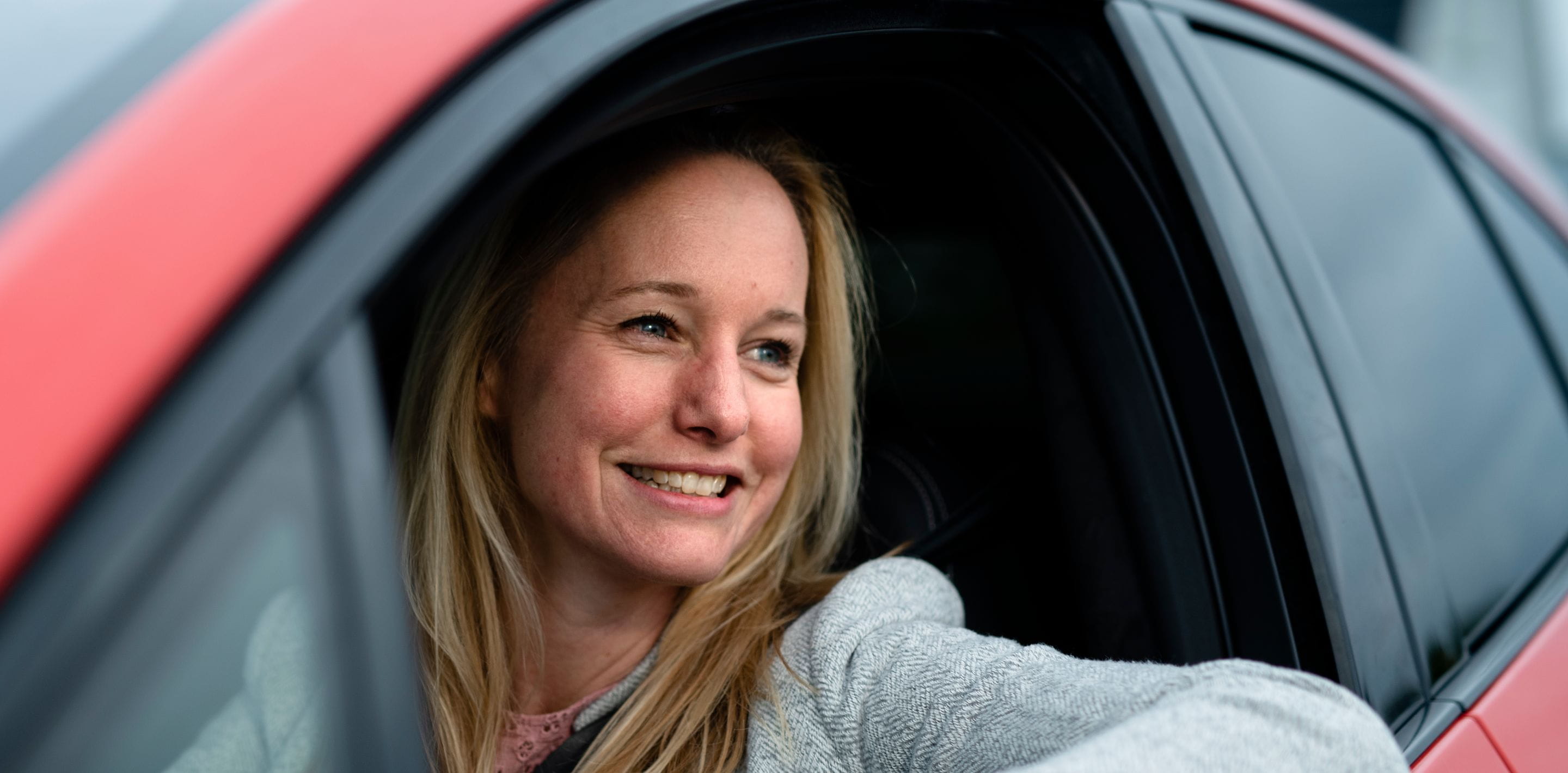 Close up of woman looking out of car window